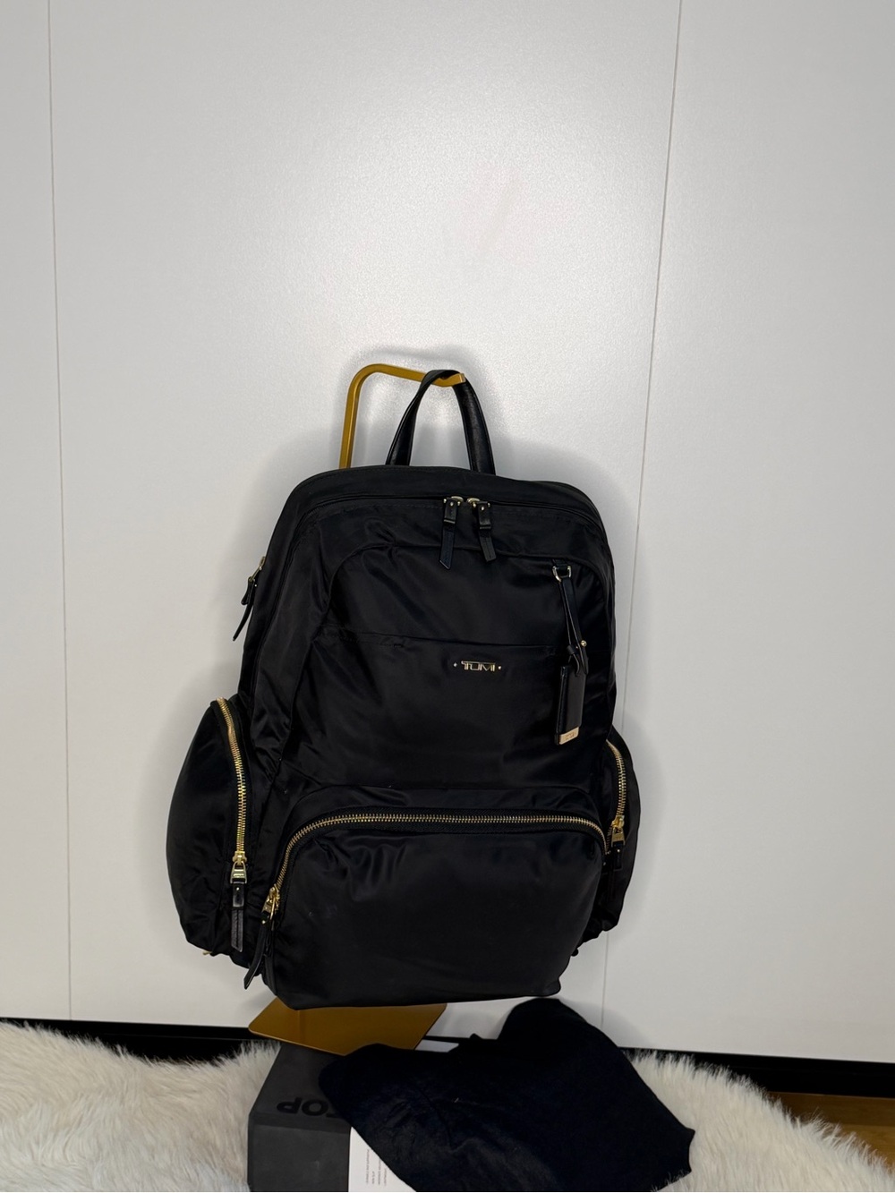 Tumi Black Backpack with Gold Hardware Accents